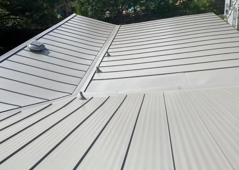 Solar attic fan installed on a metal roof for Roof Ventilation in East Port Orchard